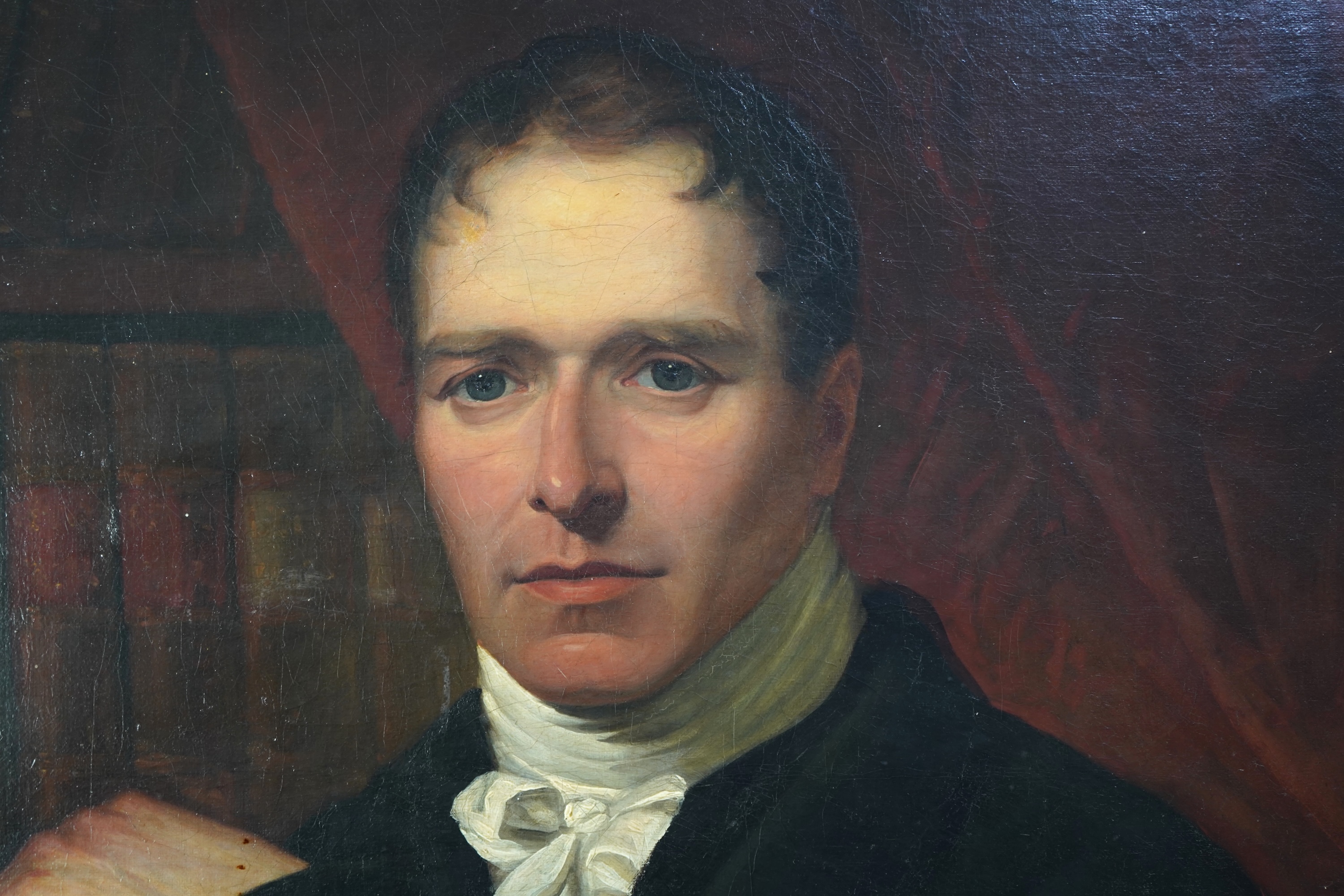 English School, 19th century, A portrait of a scholarly gentleman holding a book